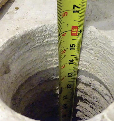 The concrete substrate of this buckling floor had been raised with over 200 cubic yards of concrete.