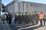 Employees at Satin Flooring set up a picket line in front of the company Dec. 7. Source: Teamsters Canada