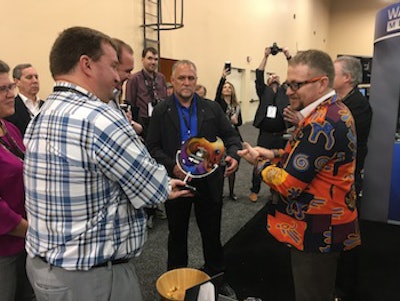 Fishman Flooring representatives receive the Distributor of the Year Award from Wagner Meters during TISE 2019.