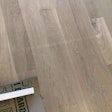 Taping to wood floor finish before it's fully cured can result in marks like these in your finish. (Photo courtesy of Bill Cavey)