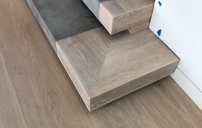 The stairs on this job had been coated with the same finish as the flooring upstairs—the wrong color. This created a particular challenge because they have inlaid suede perfectly even with the wood, meaning they can't be sanded. Another problem is they were built with American white oak instead European white oak that was used for the flooring. I convinced the homeowner to do a preliminary color adjustment without deep-sanding the finish to let the stairs age for awhile before we try to make them match the floor exactly.
