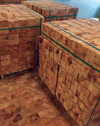 End-grain blocks should be mixed up and acclimated before installation; these pine blocks are at a Connecticut school.
