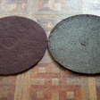The maroon pads that we take for granted today were a direct result of the advent of waterborne finishes. Not only are they good for intercoat abrasion, they are also great for cleaning a floor in preparation for recoating. In this photo you can see the amount of dirt and grime removed by the pad on the right before this historic floor was recoated.