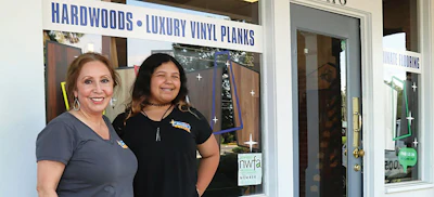 Laura Anzures in front of her store with her daughter, Alicia (12).