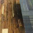 Only a year after installation, areas of the new wood flooring became discolored, with some areas turning black.