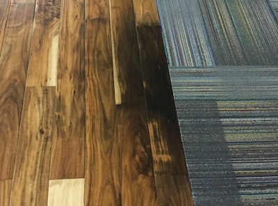 Only a year after installation, areas of the new wood flooring became discolored, with some areas turning black.