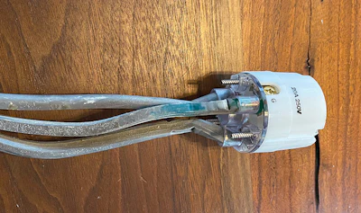 In cords like this factory-made 3-wire dryer cord, the wires are not a different color, but many have a different colored ring on the end, like the green you see here, or on the directions it will say which one is the ground. On all the ones I've seen the ground has been the middle wire, but that's important to verify.