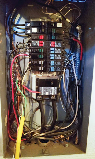 If you need to get power from a panel, I urge you to have it done by someone legally authorized to do so.