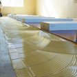 The fundamentals of gluing down a wood floor are the same no matter whether it's engineered or solid. (Photo courtesy of Sika Corporation)