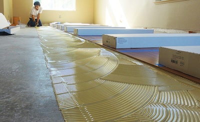 The fundamentals of gluing down a wood floor are the same no matter whether it's engineered or solid. (Photo courtesy of Sika Corporation)
