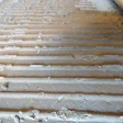 Along some wall lines, the adhesive had not transferred to the flooring.