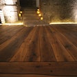 These live-edge planks were painstakingly fit together, then screwed down to a wooden substructure installed over a stone floor.
