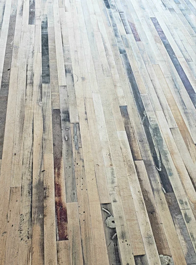 Traver and his crew used a combination of big machine and edger to sand, careful to leave as much of the unique character of the historic maple as possible.
