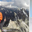 Two different lives: At left, a selfie on the summit of Daugou East (elevation 5,462 m/17,920 feet) at Siguniang National Park in Sichuan, China. At right, working on a live-edge install in Charleston, W.Va.