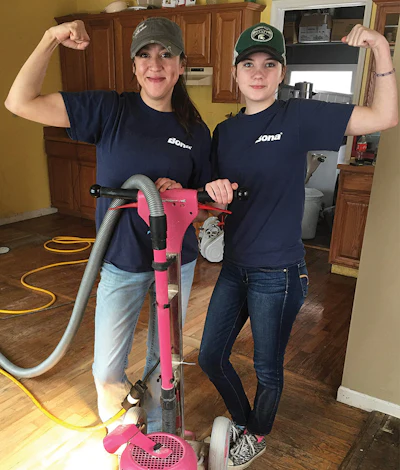 Peterson and her niece, Kennedy Wells, pose with Peterson's signature