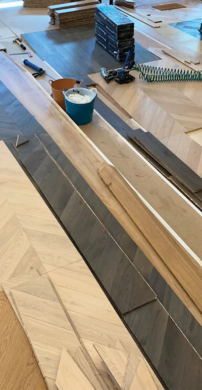 Here you can see spans of the chevron 'folds.' We installed each 'folded' riser before the ramp flooring below it and hid the riser cut behind the ramp flooring.