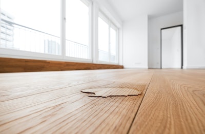 The simple test of a capful of water on a floor can help indicate if it's safe to recoat.