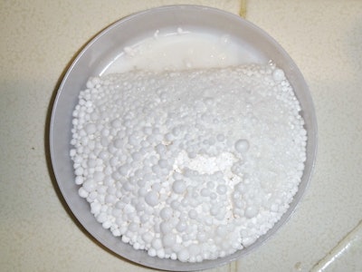 Usually the granules in the calcium chloride test look the same after testing, and only a scale can determine any difference, but on this job the moisture was so high (between 10 and almost 13 pounds) they were semi-liquified. (Photo courtesy of Angelo DeSanto)