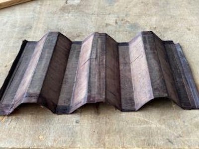 Densified birchwood veneer hot-pressed into corrugated decking using aqueous phenolic adhesive. Photo by Marco Lo Ricco.