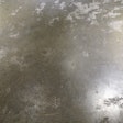 This concrete subfloor was too smooth for the flooring adhesive.