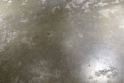 This concrete subfloor was too smooth for the flooring adhesive.