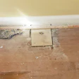 Once you pull carpeting up, you can find complications the homeowners didn’t know about, like this plywood from where a wall was removed.