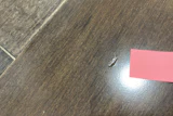 Thickness of a veneer doesn’t necessarily translate to dent-resistance; this dent was on a 3-mm sawn-face lamella.