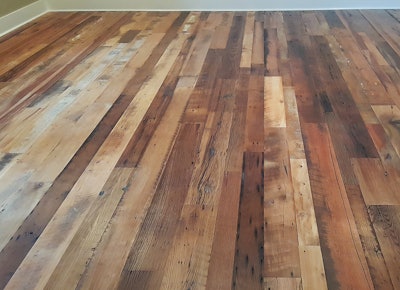 This is one of our best-selling floors: reclaimed barnwood in mixed species. These floors are not culled; they have all of the species that typically came from the property where the barn was built. This floor was sanded on site to the customer's specs and coated with a satin two-component water-based finish.