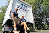 Gary Horvath, wearing his typical work uniform of T-shirt, shorts and Asics volleyball knee pads, and wife Lisa Horvath.