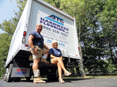 Gary Horvath, wearing his typical work uniform of T-shirt, shorts and Asics volleyball knee pads, and wife Lisa Horvath.