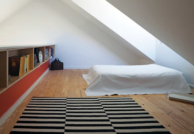 The floors in the loft are structural two-by-six, tongue-and-groove pine boards, installed and finished by Clayton Homes