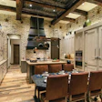 The kitchen features rough-to-the-touch engineered flooring reclaimed from barn beams.