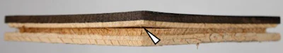 Figure 2: The curling at the panel corners had induced a split in the core, which originated at the angle in the groove base.