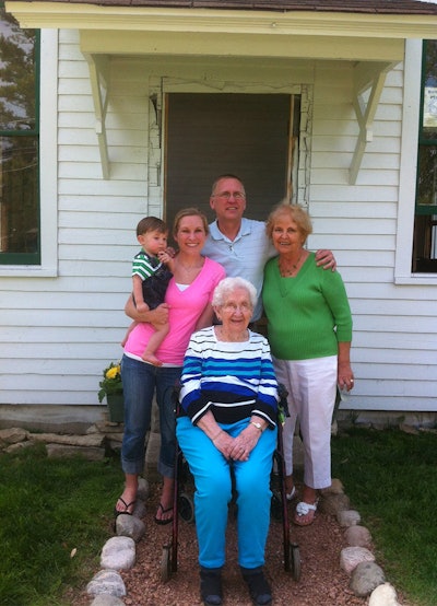 Five generations of Merrill's family, with Eunice 'Granny' Andreas at center, in front of the Ford School.