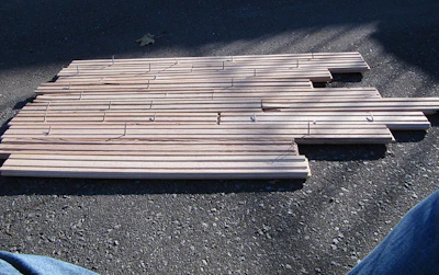 Reassembling the removed wood flooring on the driveway revealed many problems with the fasteners.