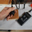 The flooring wear layer (top) and plywood core (bottom) were tested for moisture content using an invasive pin meter.