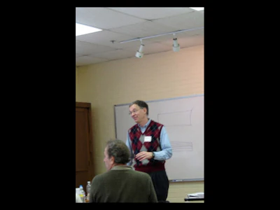 Dr. Mitchell, a guiding force behind these classes, reacts to a statement from an inspector. Dr. Mitchell has adopted wood flooring inspectors and the wood flooring industry.