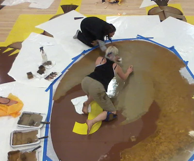 'Countless layers' of paint and transfer paper, along with three artists, were necessary to complete the Spartans graphics on the San Jose State University basketball floor.
