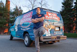 Felix Roman of Wood Flooring Doctor with his work van, which won Best Exterior Graphics in the 2022 WFB Truck & Van Contest.