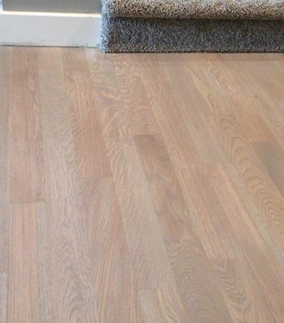 Gray stain on a white oak floor with water-based finish is a tricky job—but not impossible.