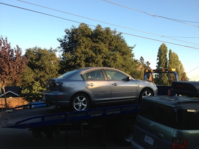 The Mazda I launched my flooring business in logged a little over 200,000 miles before it got towed, fixed and donated.