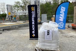 At the groundbreaking ceremony in Virginia, Alquist 3D banners mark the Black Buffalo 3D NEXCON printer, while the super-sack of Planitop 3D sits in front of the MAPEI Corporation banner.