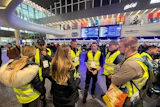 The Nantucket Cares team in the Warsaw train station. 'We relocated 100 families that day and provided food and transportation to other countries inside the E.U.,' Yates said.