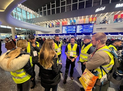 The Nantucket Cares team in the Warsaw train station. 'We relocated 100 families that day and provided food and transportation to other countries inside the E.U.,' Yates said.