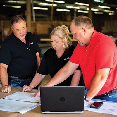 Here I’m pictured with (on my left) Project Superintendent Bruce Western and our COO, James Colten.