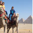 An offer to buy my business when my son was young prompted me to prioritize taking family trips around the world while he was growing up, including our first trip to Egypt, pictured. At right, I’m at my retirement party this year with Matt Poole, who bought my business.