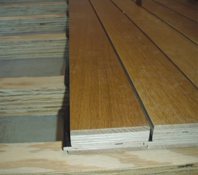 Woodwright Hardwood Flooring Company generated several ideas for creating the requisite consistent gap between boards before settling on this unique design with tabs toward the bottom of the flooring every 12 inches on center.