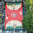 This portable wood court was installed in Harlem's Rucker Park for the Entertainers Basketball Classic, a three-month celebrity basketball tournament.