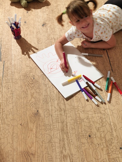 Made of oak, Mafi's CNC-cut Carving Kids flooring is designed to be colored with crayons or markers.