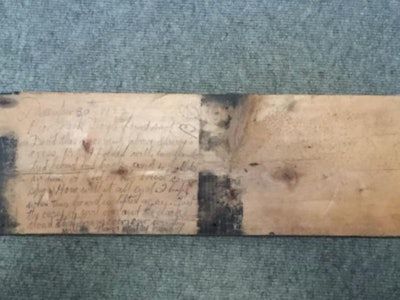 A floorboard with a 100-year-old wartime message on it was donated to the Louth County Museum in Dundalk, Ireland.